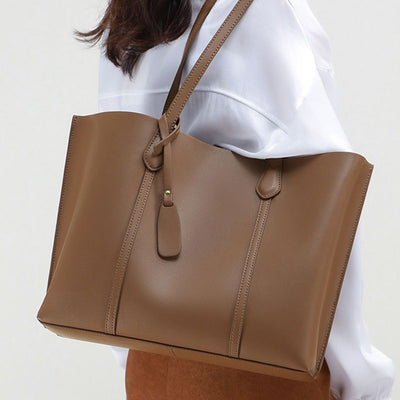 Preppy leather shoulder bag women, stylish cowhide crossbody bag, light luxury commuter Tote bag